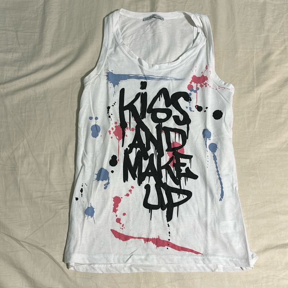 Long tank top with design in front. Size S, feels like M. Never worn